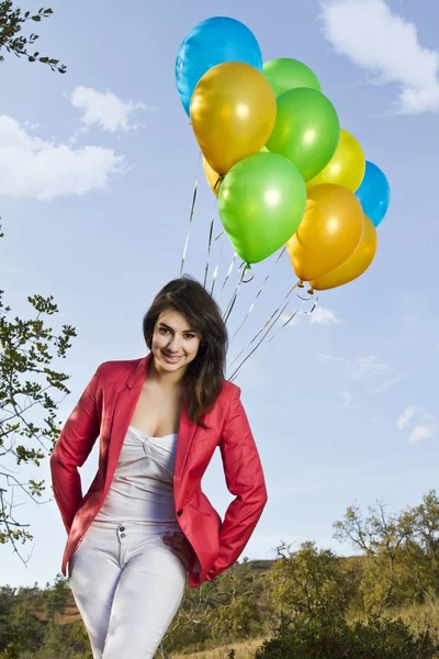 Girl with balloons — Stock Photo, Image