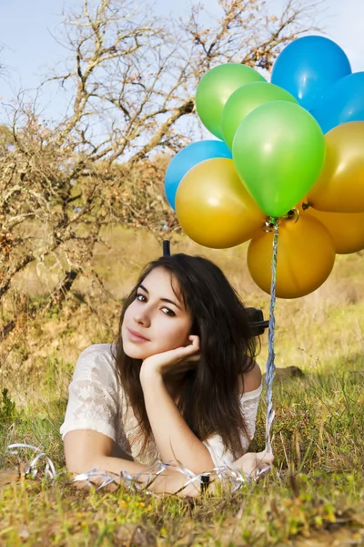 Girl with balloons — Stock Photo, Image