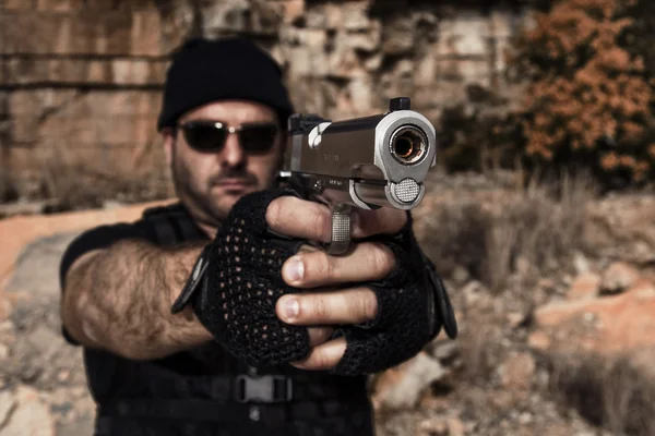 Man pointing a gun to the camera — Stock Photo, Image