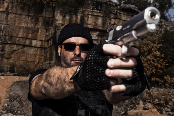 Man pointing a gun to the camera — Stock Photo, Image