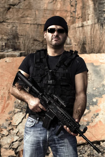 Man with a machine gun — Stock Photo, Image