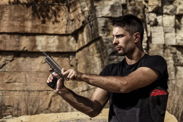 Menacing man with a handgun — Stock Photo, Image