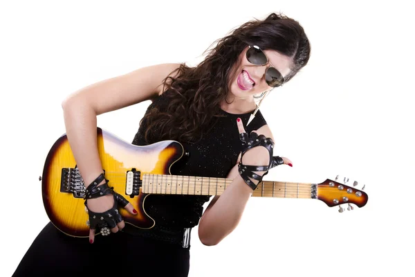 Beautiful girl in dark leather clothes holding an electric guitar — Stock Photo, Image