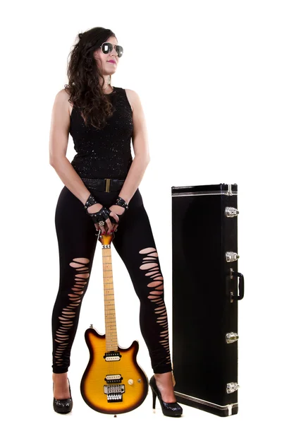 Beautiful girl in dark leather clothes holding an electric guitar — Stock Photo, Image