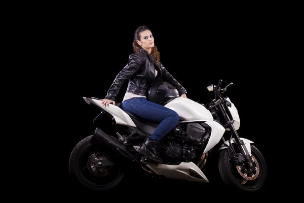 Beautiful girl next to a white motorbike — Stock Photo, Image