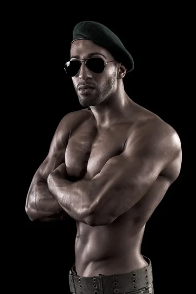 Muscled man on a black background — Stock Photo, Image