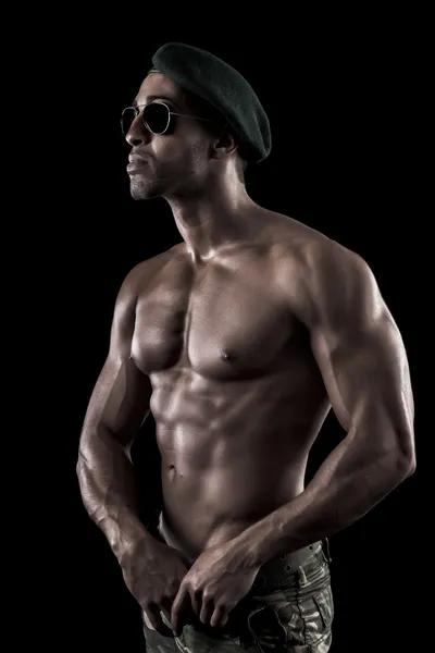 Muscled man on a black background — Stock Photo, Image