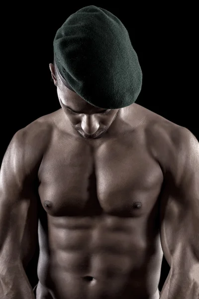 Muscled man on a black background — Stock Photo, Image