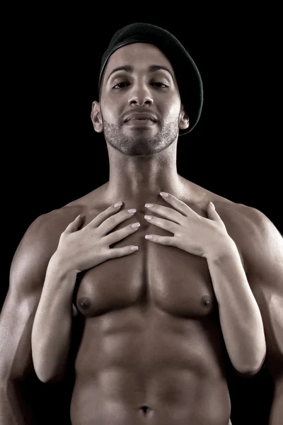 Muscled man on a black background — Stock Photo, Image