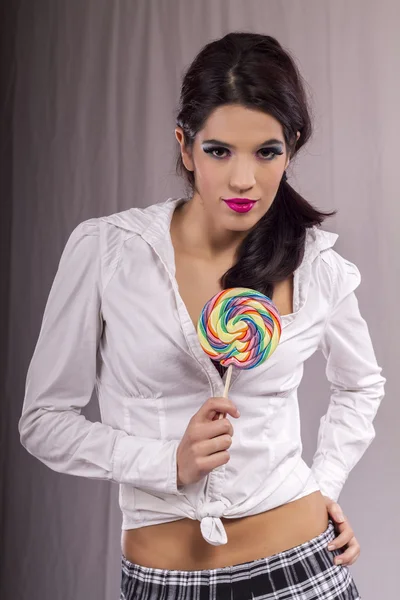 Mooi meisje met een lolly — Stockfoto