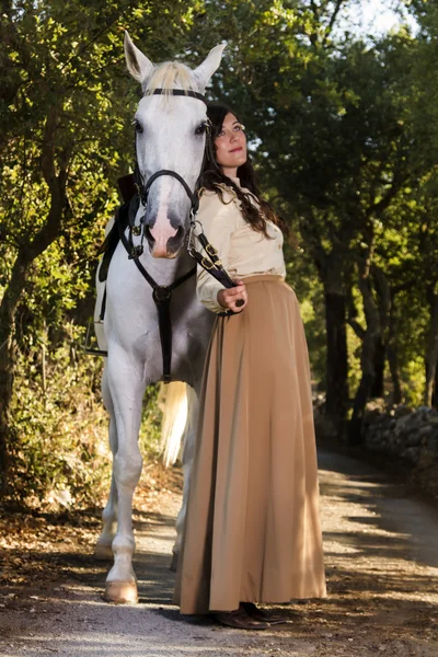 Classical girl with a white horse — Stock Photo, Image