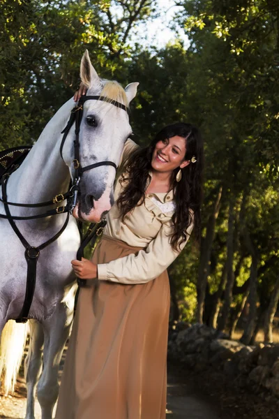 Classical girl with a white horse Royalty Free Stock Photos