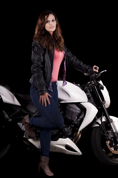 Beautiful girl next to a white motorbike — Stock Photo, Image