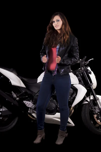 Beautiful girl next to a white motorbike — Stock Photo, Image