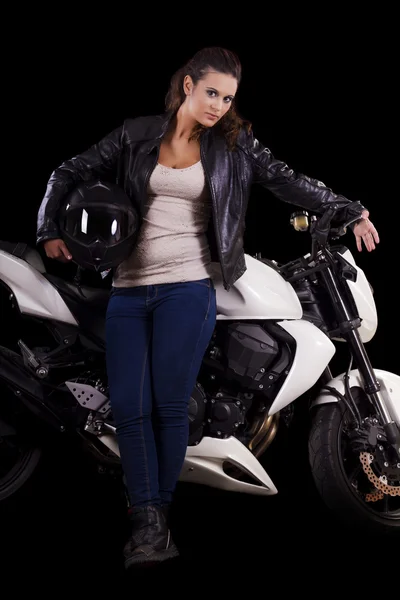 Beautiful girl next to a white motorbike — Stock Photo, Image