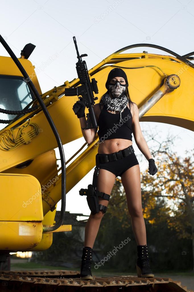 beautiful girl with weapon and mask