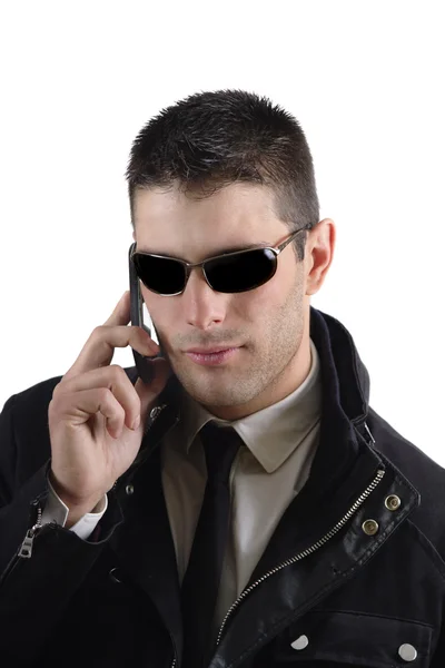 Man on a suit with jacket answering cellphone — Stock Photo, Image