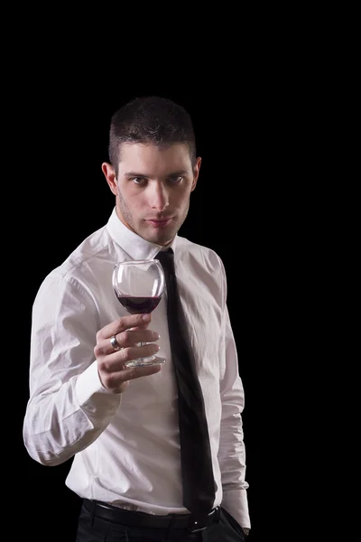 Hombre sosteniendo una copa roja de vino fino —  Fotos de Stock