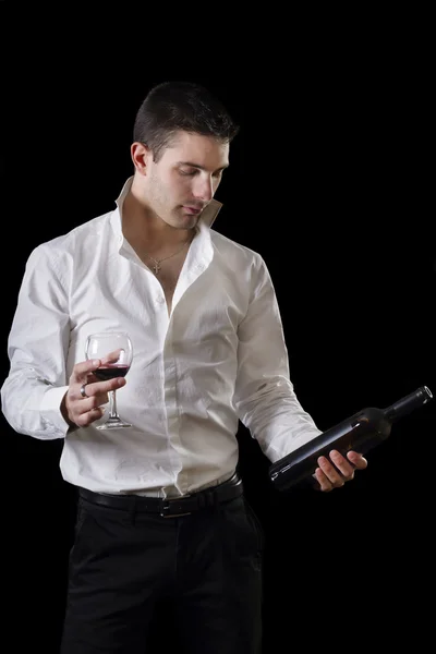 Man holding a red glass of fine wine — Stock Photo, Image