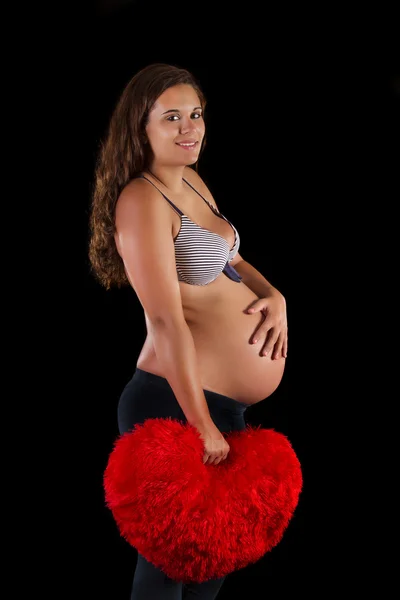 Schöne schwangere Mädchen im Studio. — Stockfoto