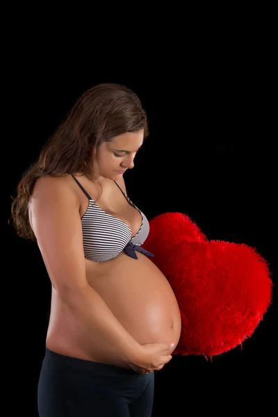 Schöne schwangere Mädchen im Studio. — Stockfoto