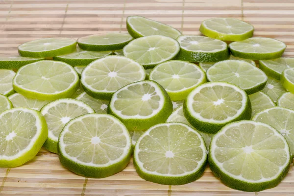 Bunch of round slices of lime fruit — Stock Photo, Image