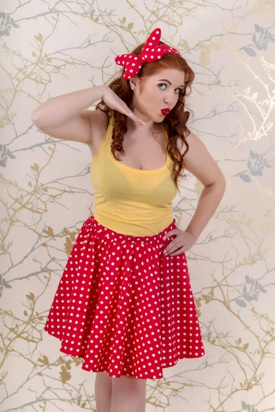 Beautiful pinup redhead girl with skir — Stock Photo, Image