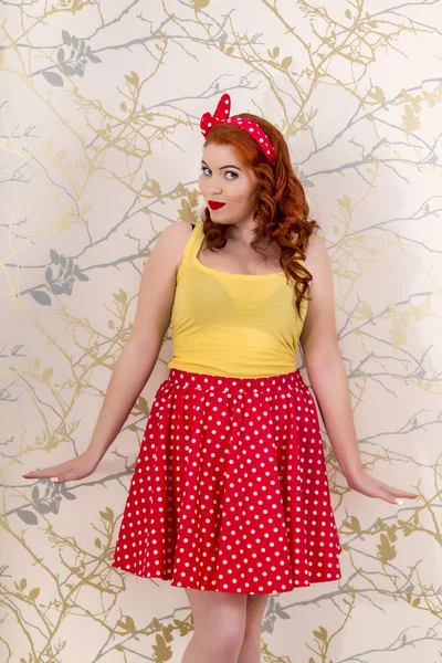 Beautiful pinup redhead girl with skirt — Stock Photo, Image