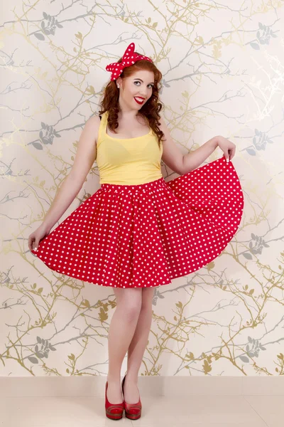 Beautiful pinup redhead girl with skirt — Stock Photo, Image