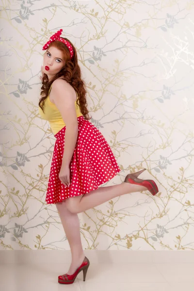 Beautiful pinup redhead girl with skirt — Stock Photo, Image