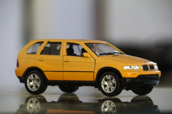 Yellow miniature toy car — Stock Photo, Image