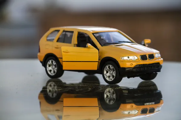Yellow miniature toy car — Stock Photo, Image