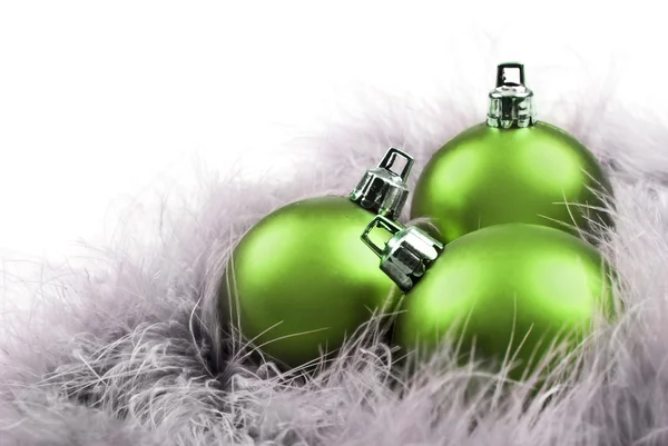 Colorful christmas baubles on a white background with space for text Royalty Free Stock Photos