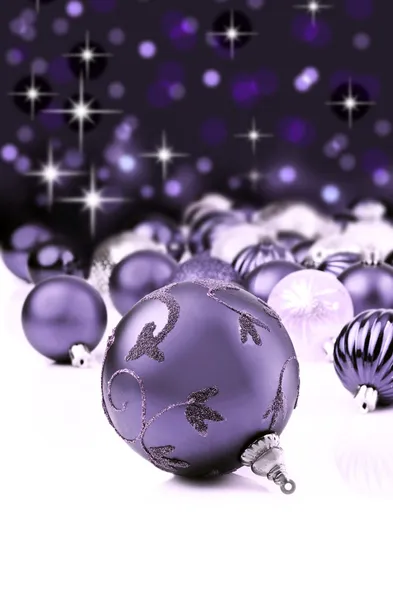 Purple decorative christmas ornaments with star background — Stock Photo, Image
