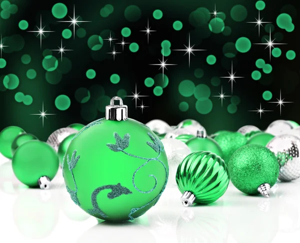 Green christmas ornaments with star background Royalty Free Stock Images