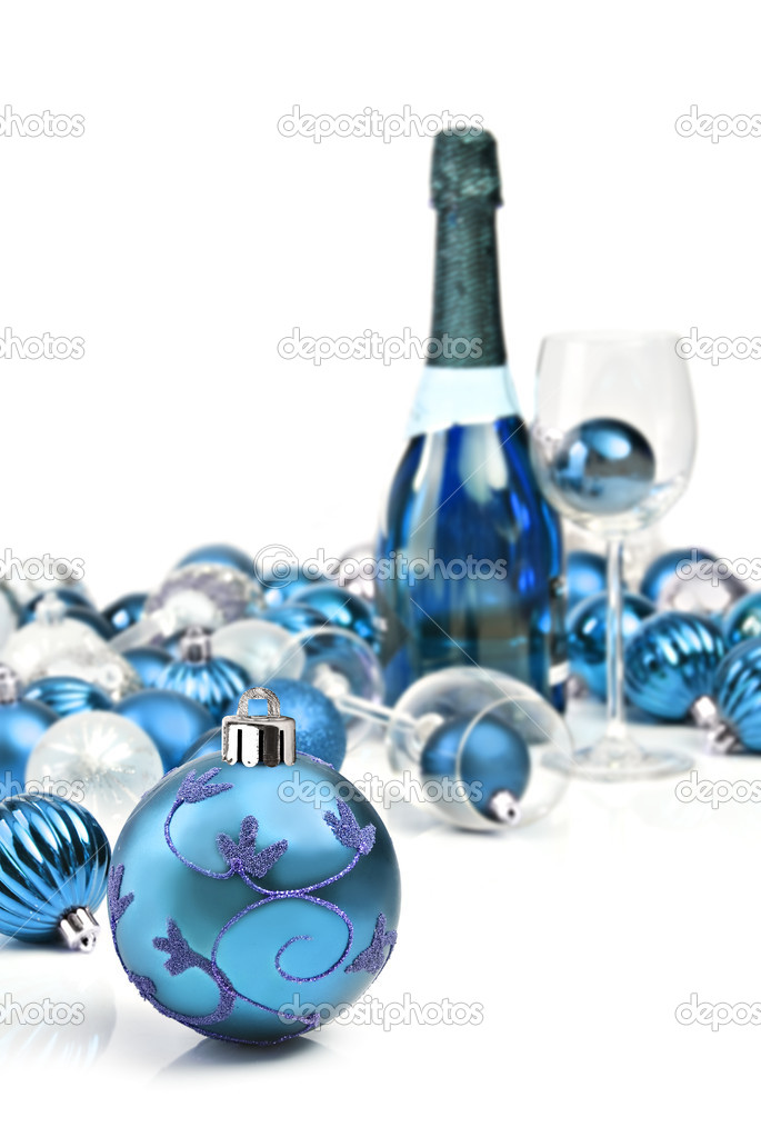 Blue Christmas ornaments with a bottle of sparkling wine