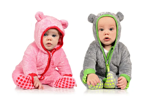 Six month old twin brother and sister on white — Stock Photo, Image