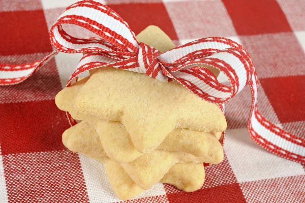 Star cookies with ribbon on checkered cloth — Stock Photo, Image