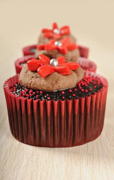 Chocolate cupcakes in red cups Stock Image