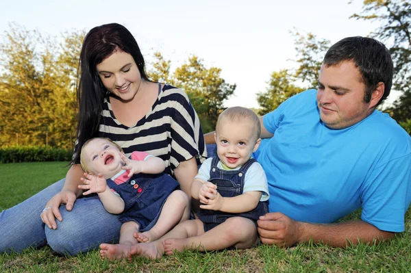 Beautiful young family with twin babies — Stock Photo, Image