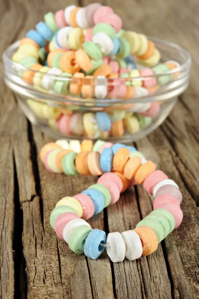 Candy on strings on wooden background — Stock Photo, Image