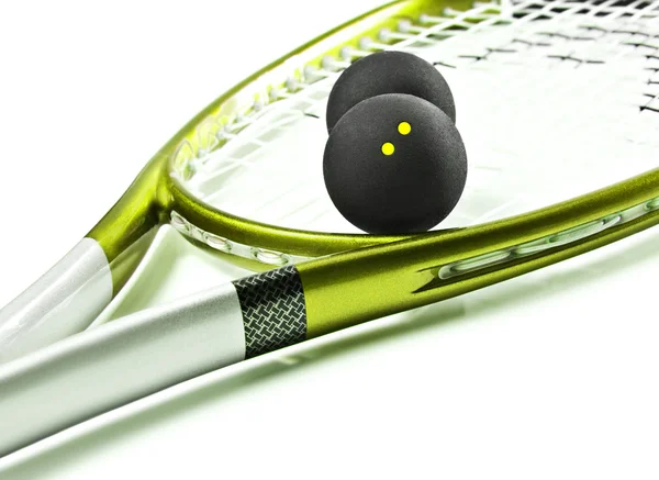 Green and silver squash racket and balls — Stock Photo, Image