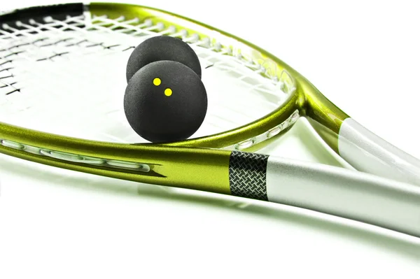 Green and silver squash racket and balls — Stock Photo, Image