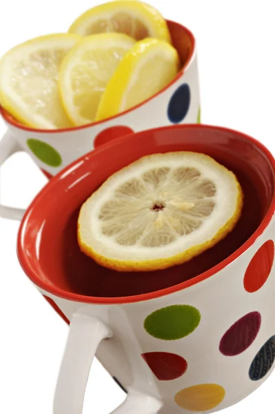 Zdrowe herbaty ziołowe z cytryny w kropki kubki — Zdjęcie stockowe