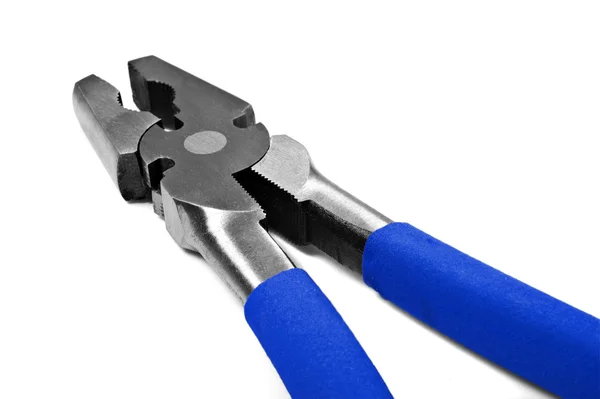 Närbild makro metall tång med blått handtag Stockfoto
