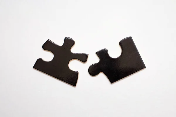 Deux Puzzles Noirs Sur Fond Blanc Puzzle Pour Développement Intelligence — Photo