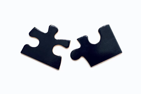 Due Puzzle Neri Sfondo Bianco Primo Piano Puzzle Sviluppo Dell — Foto Stock