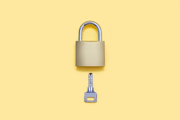 Closed Lock Key Yellow Background Golden Color Lock Silver Key — ストック写真