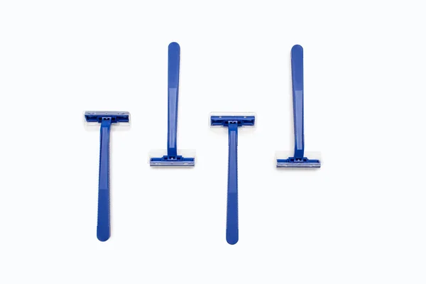 Four Blue Plastic Razors White Background Center Disposable Blue Plastic — 스톡 사진