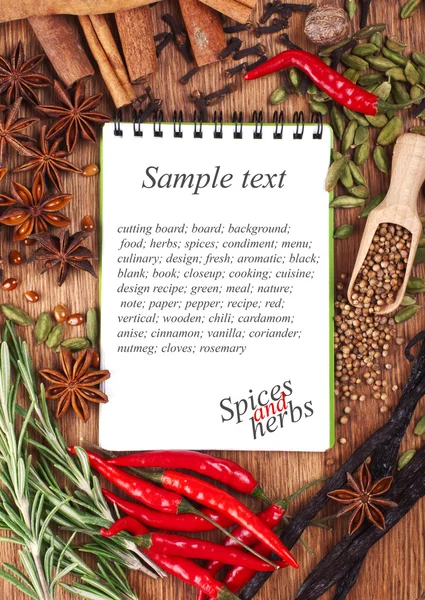 Open notebook with spices and herbs — Stock Photo, Image